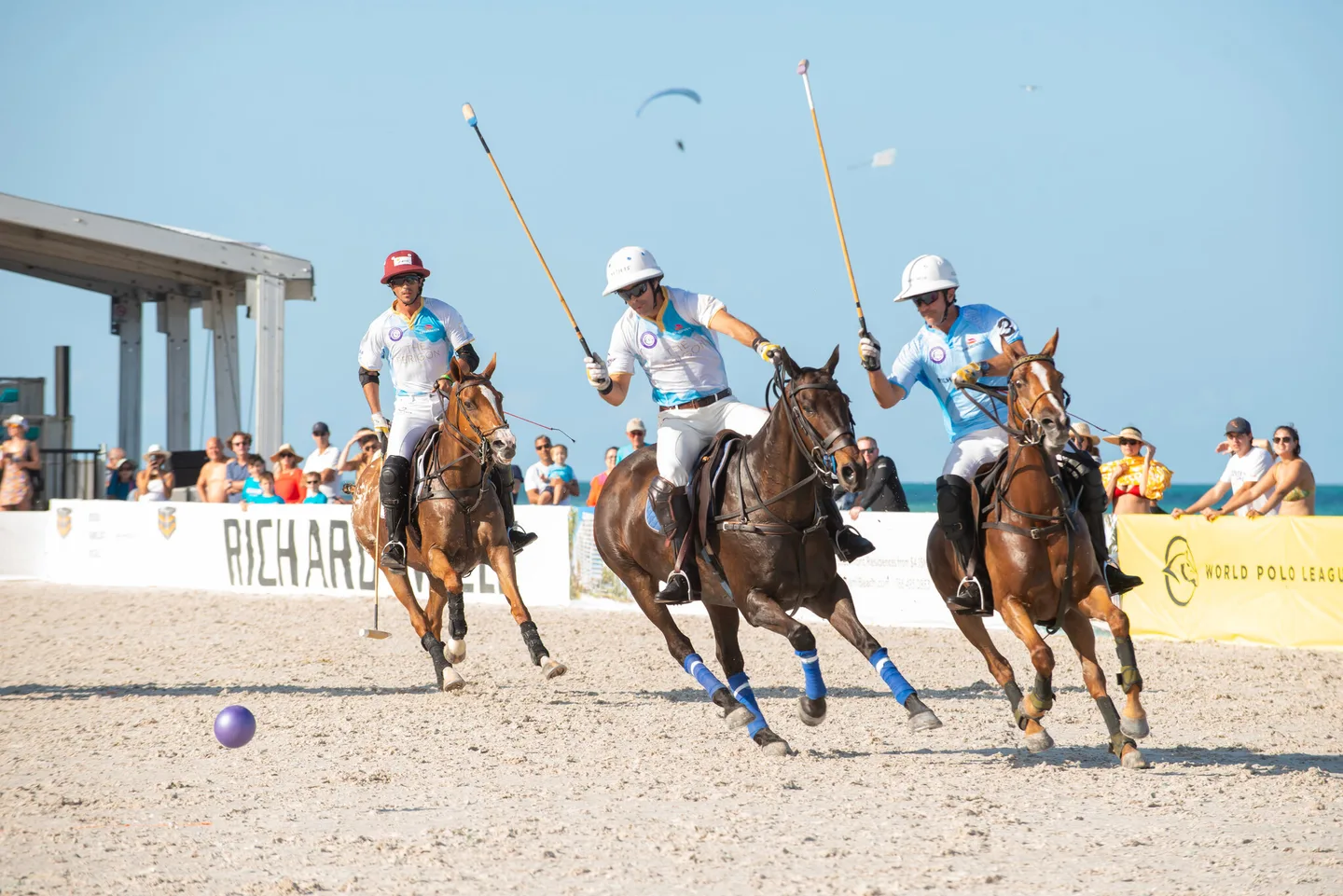 Nacho Figueras, center, during the Miami Beach Polo World Cup. Each player brings about a dozen ponies to a match.