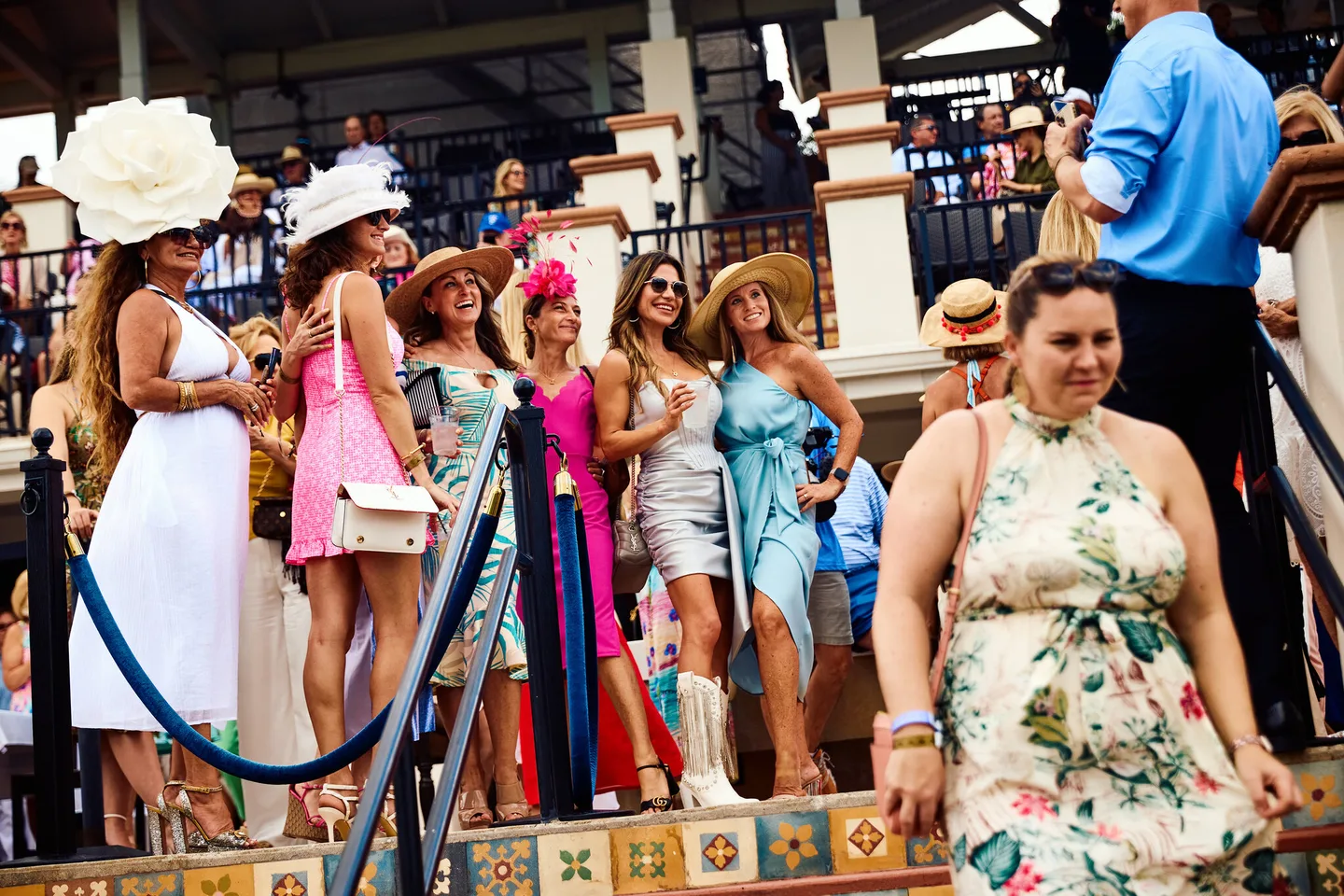 At U.S. Open Polo Championship, attendees dressed in sport coats, sundresses and very large hats.